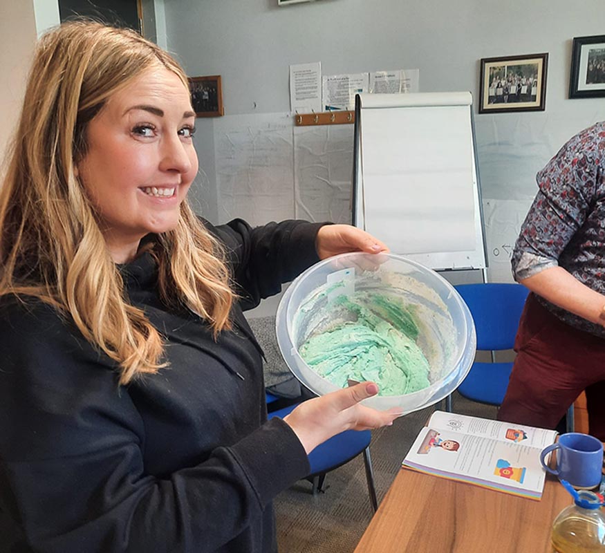 A women shows off her baking at Doodle steam event