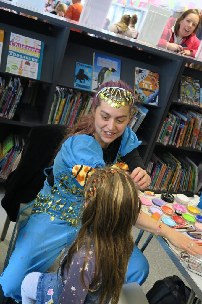 Family Fun kids and parents at a CDI event facepainting